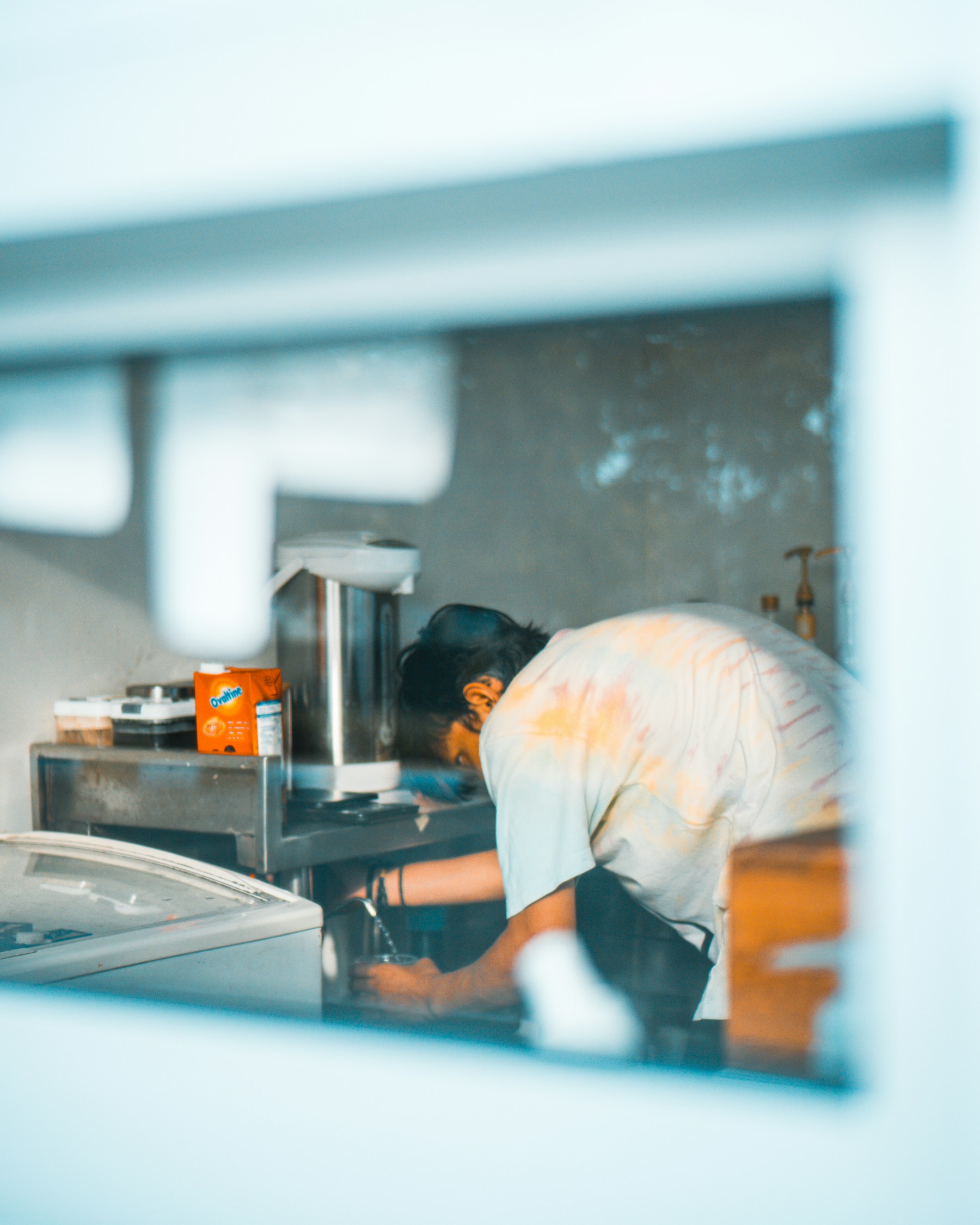 Craftsperson working in a kitchen during cabinet installation